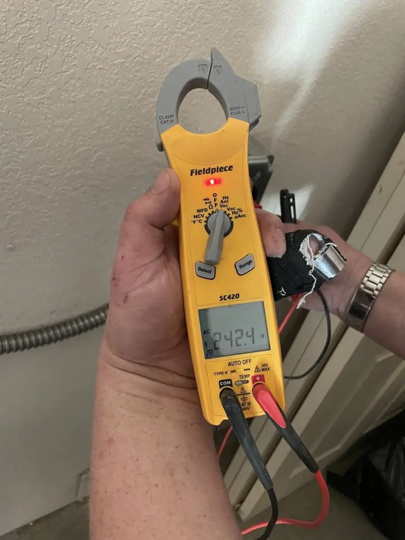 Voltage testing with clamp meter during Electrical Installation Services in Redwood